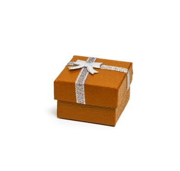 Orange color gift box with silver ribbon isolated on white background