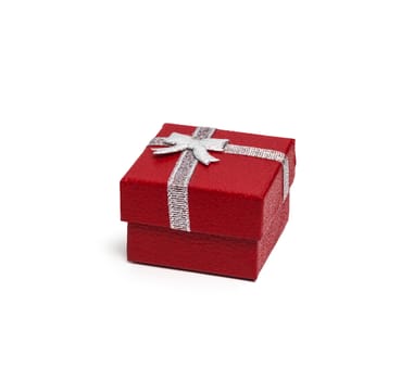 Red gift box with silver ribbon isolated on white background