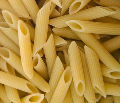 Pasta penne macaroni background wallpaper. Products from flour.