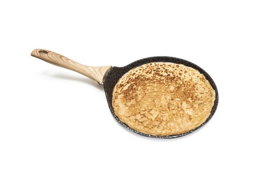 Frying pan with pancake isolated over white background