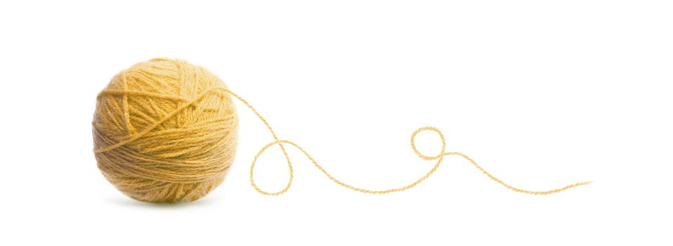 Orange ball of Threads wool yarn isolated on white background