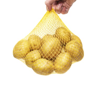 Potatoes fresh in the package. Man holds in hand