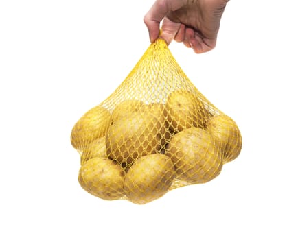 Potatoes fresh in the package. Man holds in hand