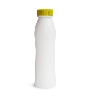 Milk or shampoo plastic bottle with yellow cap. Isolated on white background