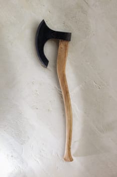 Ancient battle axe on the stone background white wall. With clipping path