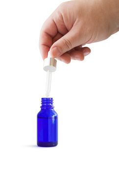 Dropper Bottle. Blue conteiner isolated on white background. With clipping path