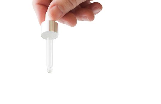Hand holding a medicine pipette, isolated on white background. With clipping path