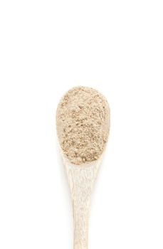 Dry garlic spices in wooden spoon isolated on white background