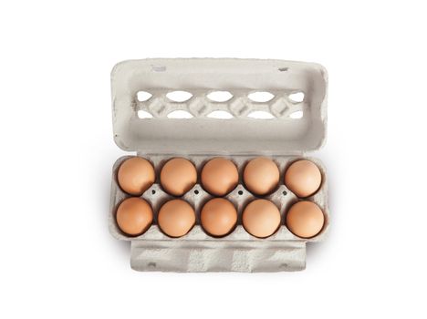 Eggs in cardboard rack on white background, mock up, copy space