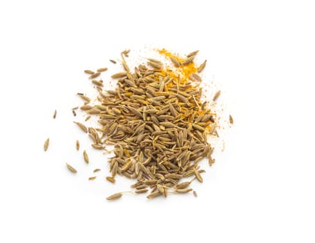 Pile of cumin seeds isolated on white background