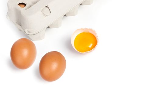 Chicken eggs in pulp egg carton isolated on white background