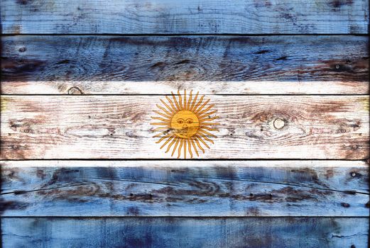 Flag of Argentina painted on grungy wood plank background