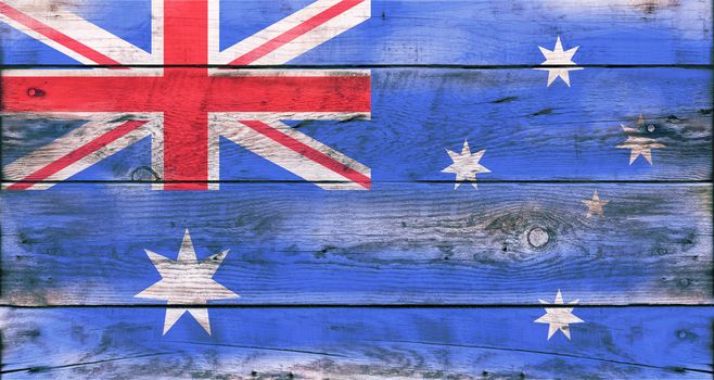 Flag of Australia painted on grungy wood plank background