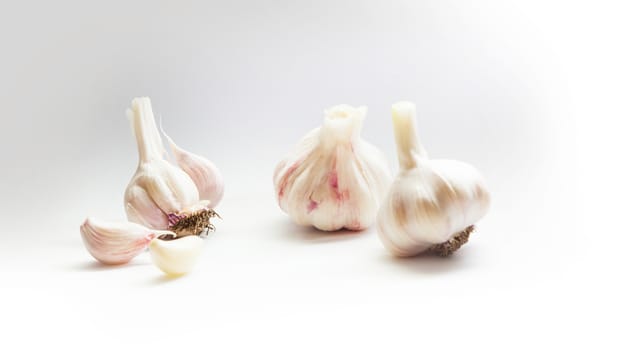 Garlic group and slices. Isolated on white background.