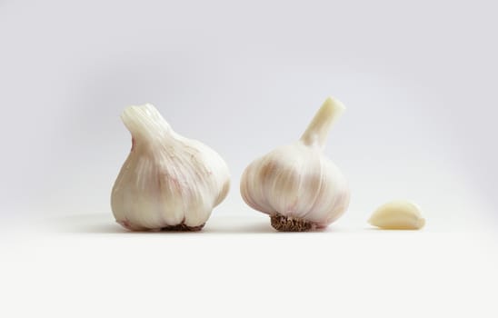 Garlic group and slices. Isolated on white background.