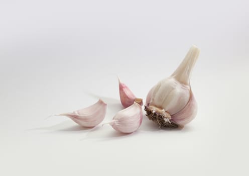 Garlic group and slices. Isolated on white background.