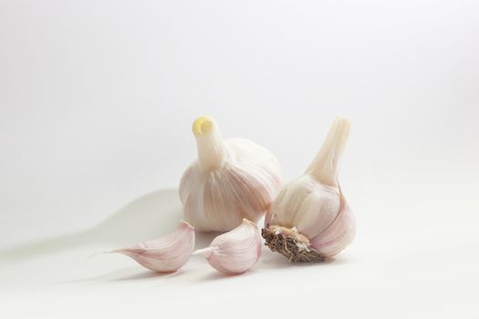 Garlic group and slices. Isolated on white background.