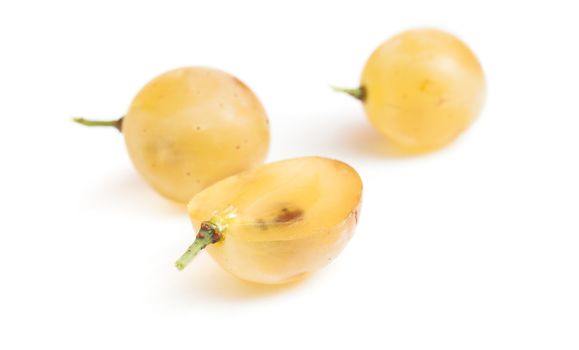 Grapes white ripe slices fresh. Close-up shot. Macro not in focus. Isolated on white background.