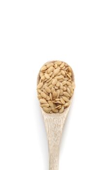 flax seed spices in wooden spoon isolated on white background