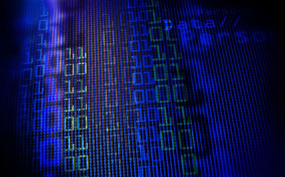 Digital binary data on computer monitor screen. Close-up with small depth resolution