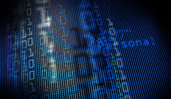 Digital binary data on computer monitor screen. Close-up with small depth resolution