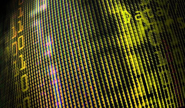 Digital binary data on computer monitor screen. Close-up with small depth resolution