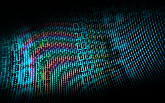 Digital binary data on computer monitor screen. Close-up with small depth resolution