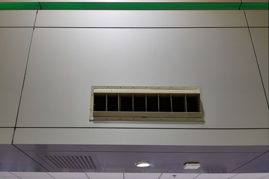 Outlet of air condition on wall with copy space at international airport terminal.