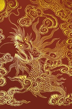 Chinese dragon painted on a wall with golden paint