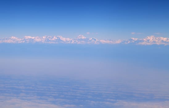 Himalaya mountains, in the clouds, view from the airplane