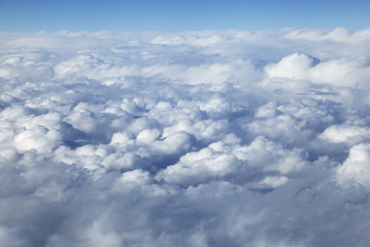 Wing of an airplane and the land below