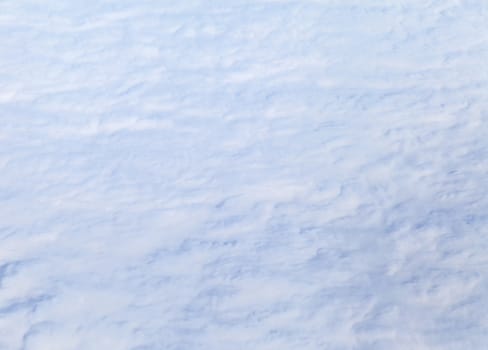 Wing of an airplane and the land below