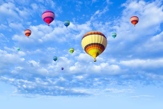 Hot air balloon flying in a blue sky