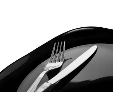 Knife and fork at plate on white background. With clipping path