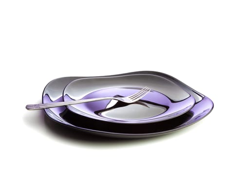 Fork at two black plates on white background