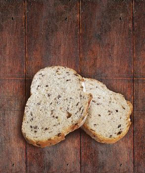 Sliced rye bread with linseed on wooden background. With clipping path