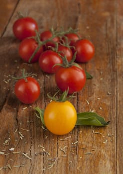 Cherry tomatoes on a wooden surface with natural light