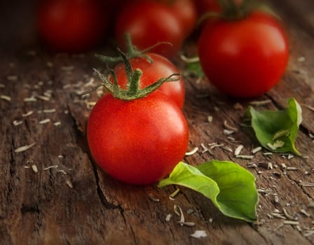 Tomatoes cherry on a wooden surface with natural light