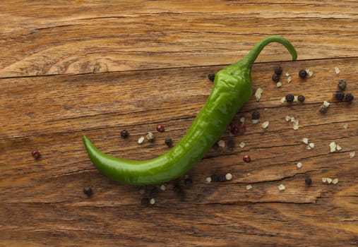 Green pepper on wood background