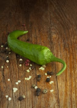 Green pepper on wood background