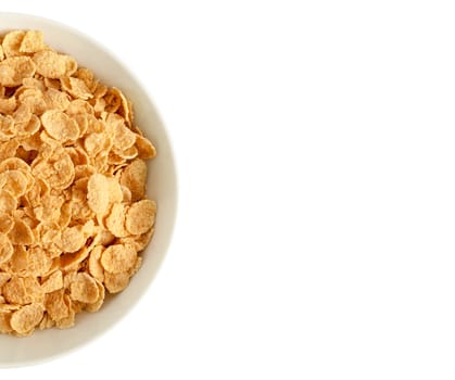 Corn flakes isolated on white background. View from the top