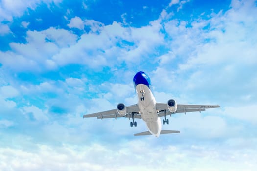 Travel by air transport, Passenger airplane in the clouds.
