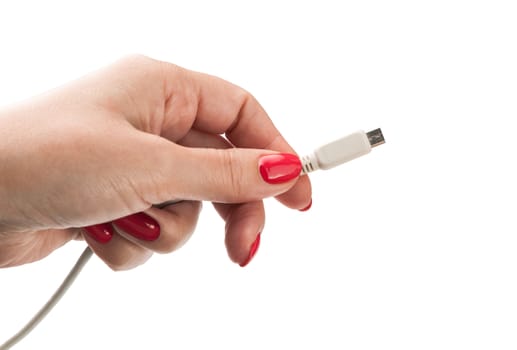 Female hand holding connector charger for mobile isolated on white background
