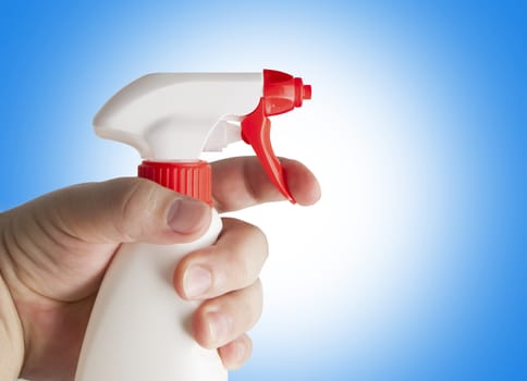 Hand holding white plastic spray bottle. With clipping path.