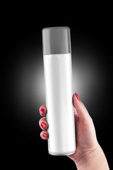 Aluminum spray can with plastic cap on hand with black background, isolated spray can on hand. With clipping path