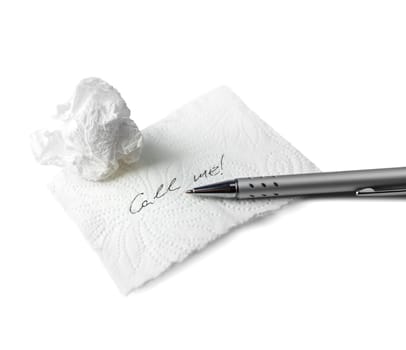Napkin With Scribbled text, paper ball and Pen on Table on white background