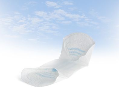 Female hygiene pad on a blue sky background. With clipping path.