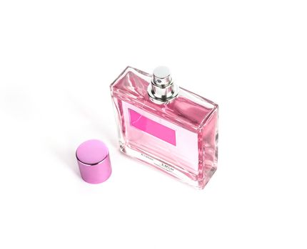 Perfume in beautiful rose color bottle isolated on white background