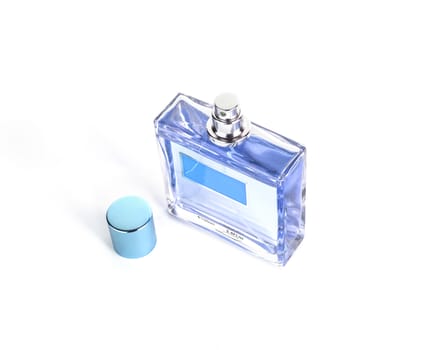 Perfume in beautiful blue color bottle isolated on white background