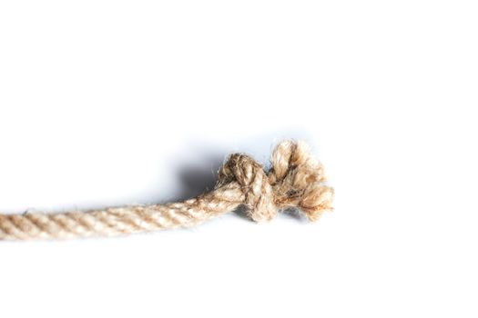 Rope with knot isolated over white background. Bluren concept